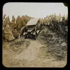 A six-wheeled car, possibly an early Morris Commercial 6x4, driving down a slope..., 1926-1929. Creator: Norman Kingsley Harrison