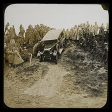 A six-wheeled car, possibly an early Morris Commercial 6x4, driving down a slope..., 1926-1929. Creator: Norman Kingsley Harrison