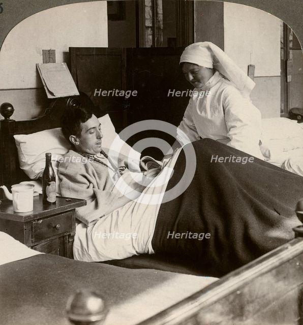 A soldier writing a letter in hospital, World War I, 1914-1918.Artist: Realistic Travels Publishers