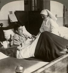 A soldier writing a letter in hospital, World War I, 1914-1918.Artist: Realistic Travels Publishers