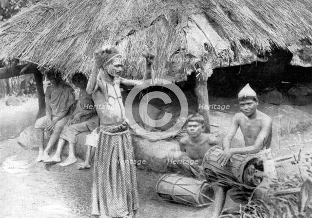 A sorcerer ejecting a spirit from a sick man in South India, 1926. Artist: Unknown