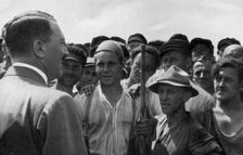 A statesman moves among the workers Germany, 1936