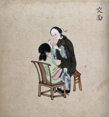 A standing woman preparing to remove facial hair from seated woman using a piece of string, 1800-99. Creator: Unknown