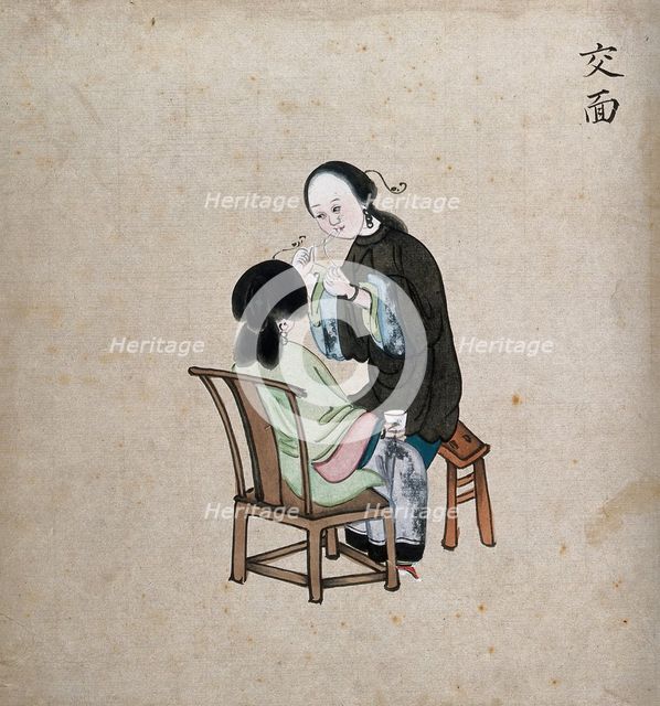 A standing woman preparing to remove facial hair from seated woman using a piece of string, 1800-99. Creator: Unknown.