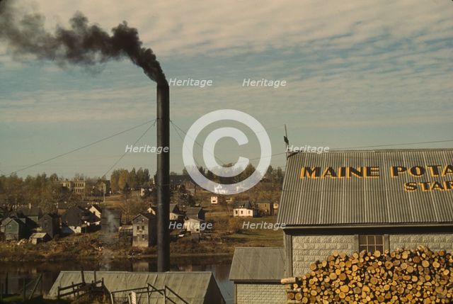 A starch factory along the Aroostook River, Caribou, Aroostook County, Maine., 1940. Creator: Jack Delano.