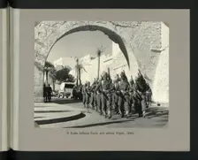 A Sudan Defence Force unit enters Tripoli, 1943. Showing Tripoli Castle on Piazza Italia. Creators: Colonial Office, Unknown