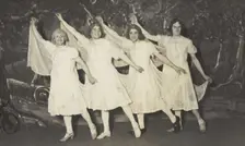 Amateur actors in drag, wearing white dresses and dancing on stage, [between 1910 and 1919?]. Creator: Unknown