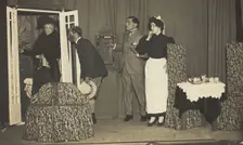Amateur actors, one in drag, perform a scene on stage, [between 1910 and 1919?]. Creator: Unknown