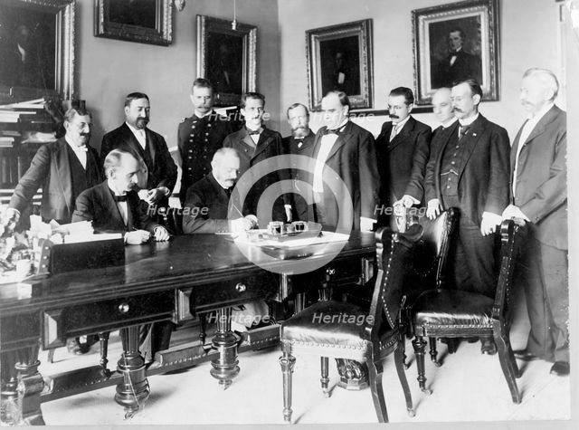 Ambassador Cambon signing the Peace Protocol, c1898. Creator: Frances Benjamin Johnston.