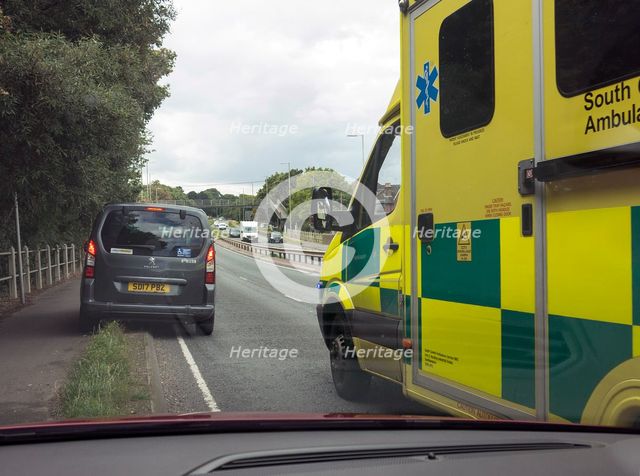 Ambulance attending road traffic accident, A35 Hampshire 2017. Creator: Unknown.