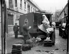 Ambulance Column depot, 9 Gower Street, London: loading up the blanket bus in Gower Mews, 1918. Creator: Unknown