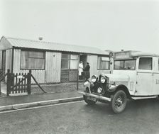 Ambulance delivering a cylinder of gas, Woolwich, London, 1946