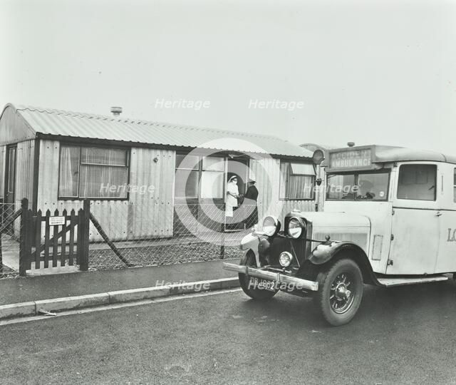 Ambulance delivering a cylinder of gas, Woolwich, London, 1946. Artist: Unknown.