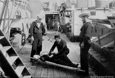 Ambulance drill on board the cruiser HMS Tartar 1896.Artist: W Gregory