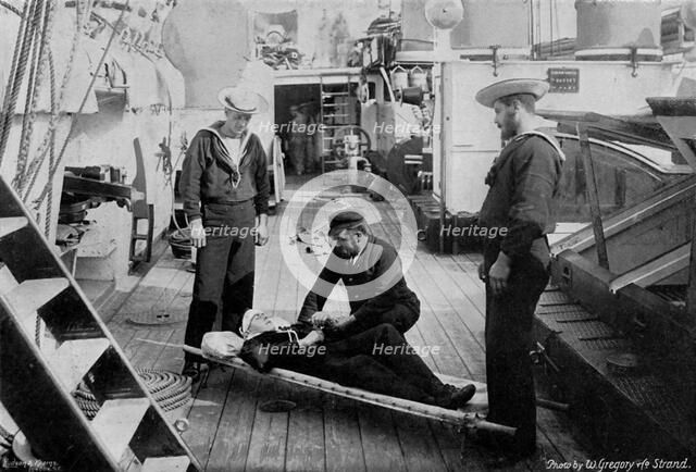 Ambulance drill on board the cruiser HMS 'Tartar', 1896.Artist: W Gregory