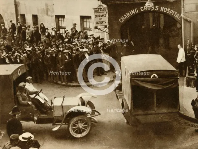 ...Ambulances carrying wounded...into Charing Cross Hospital, London, 1914, (1935).  Creator: S and G.
