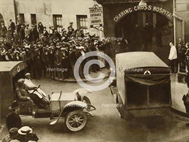 ...Ambulances carrying wounded...into Charing Cross Hospital, London, 1914, (1935).  Creator: S and G.