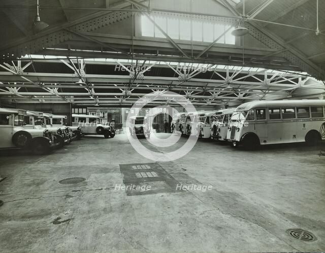 Ambulances in a garage, Western Ambulance Station, Fulham, 1939. Artist: Unknown.