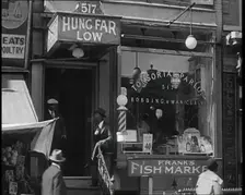 American Civilians Outside a Bobbing and Manicure Parlour, 1930s. Creator: British Pathe Ltd