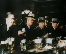 American Civilians Celebrating the End of Prohibition Drinking in a Bar, 1930s. Creator: British Pathe Ltd