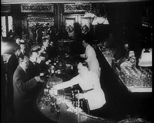 American Civilians Celebrating the End of Prohibition Drinking in a Bar, 1930s. Creator: British Pathe Ltd