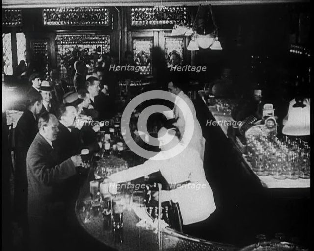 American Civilians Celebrating the End of Prohibition Drinking in a Bar, 1930s. Creator: British Pathe Ltd.
