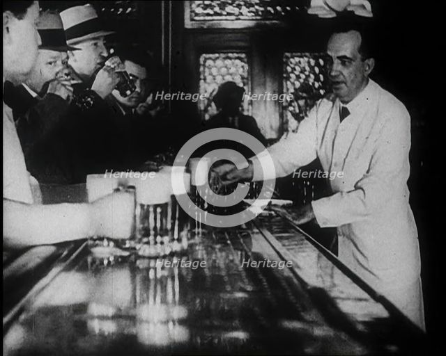 American Civilians Celebrating the End of Prohibition Drinking in a Bar, 1930s. Creator: British Pathe Ltd.