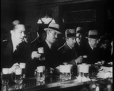 American Civilians Celebrating the End of Prohibition Drinking in a Bar, 1930s. Creator: British Pathe Ltd