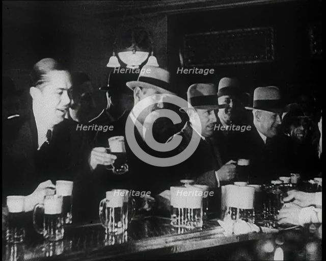 American Civilians Celebrating the End of Prohibition Drinking in a Bar, 1930s. Creator: British Pathe Ltd.