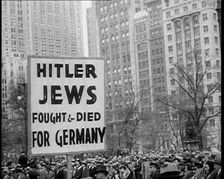 American anti-fascists Marching Holding a Sign Reading: Hitler Jews Fought & Died for..., 1933. Creator: British Pathe Ltd
