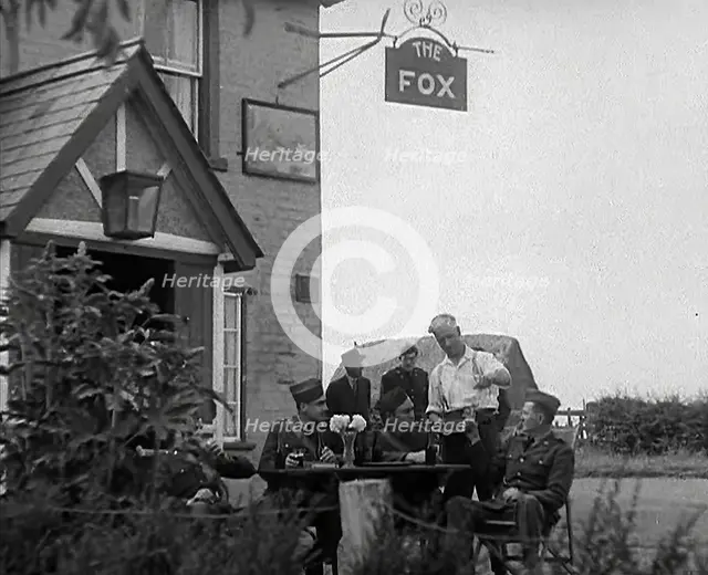American Airmen Drinking Outside a Public House in England, and Being Served by the..., 1943-1944. Creator: British Pathe Ltd.