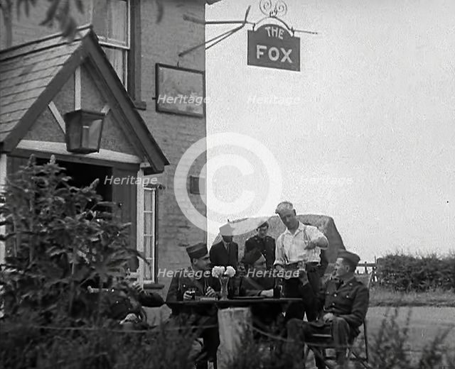 American Airmen Drinking Outside a Public House in England, and Being Served by the..., 1943-1944. Creator: British Pathe Ltd.