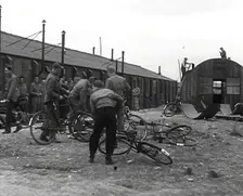 American Airmen Queueing up Outside a Building at an Airfield in England, 1943-1944. Creator: British Pathe Ltd