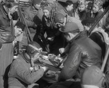 American Airmen Sitting and Eating in an Airfield, 1943-1944. Creator: British Pathe Ltd