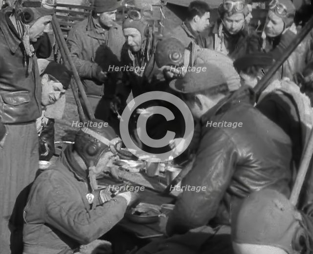 American Airmen Sitting and Eating in an Airfield, 1943-1944. Creator: British Pathe Ltd.