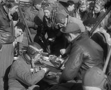 American Airmen Sitting and Eating in an Airfield, 1943-1944. Creator: British Pathe Ltd