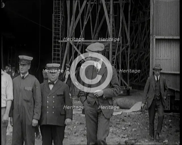 American Airship Crew Members Standing Outside the Hangar of an R 38 Airship in the United..., 1921. Creator: British Pathe Ltd.