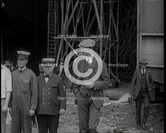 American Airship Crew Members Standing Outside the Hangar of an R 38 Airship in the United..., 1921. Creator: British Pathe Ltd.