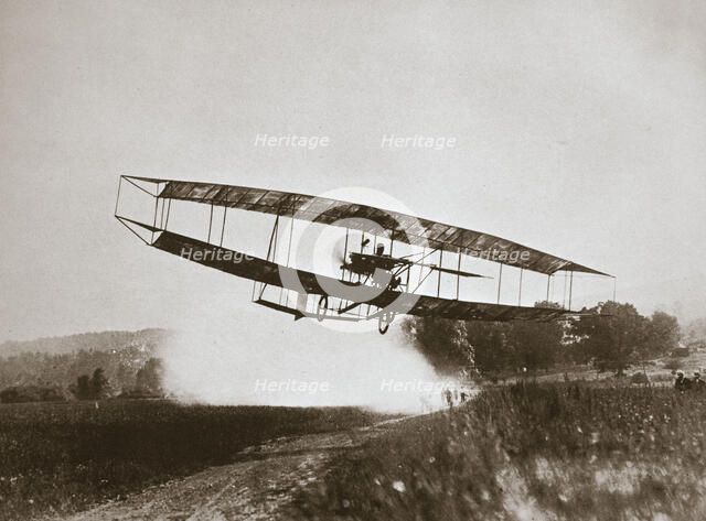 American aviator Glenn Curtiss making the first heavier-than-air flight in his 'June Bug', 1908. Artist: Edwin Levick