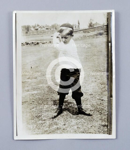 American golfer Bobby Jones playing as a young child, c1909. Artist: Unknown