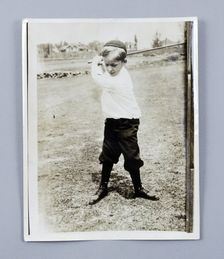 American golfer Bobby Jones playing as a young child, c1909. Creator: Unknown