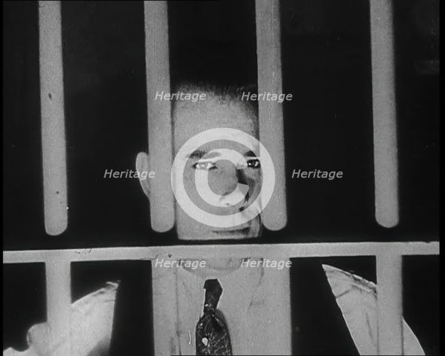 American Gangster John Dillinger Behind Bars, 1930s. Creator: British Pathe Ltd.