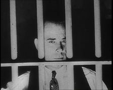 American Gangster John Dillinger Behind Bars, 1930s. Creator: British Pathe Ltd