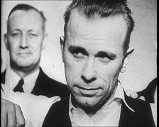 American Gangster John Herbert Dillinger Behind Bars, 1930s. Creator: British Pathe Ltd