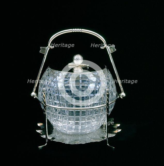 American glass biscuit barrel cut in the shape of a mesh patterned golf ball, 1910. Artist: Unknown