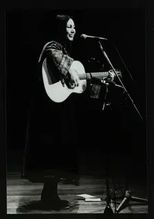 American folk musician Julie Felix on stage at the Forum Theatre, Hatfield, Hertfordshire, 1979. Creator: Denis Williams