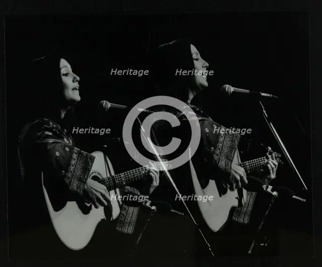 American folk musician Julie Felix performing at the Forum Theatre, Hatfield, Hertfordshire, 1979. Creator: Denis Williams.