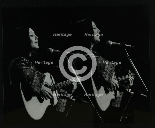 American folk musician Julie Felix performing at the Forum Theatre, Hatfield, Hertfordshire, 1979. Creator: Denis Williams.