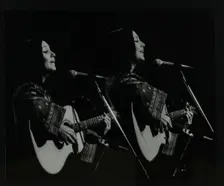 American folk musician Julie Felix performing at the Forum Theatre, Hatfield, Hertfordshire, 1979. Creator: Denis Williams