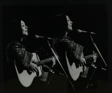 American folk musician Julie Felix performing at the Forum Theatre, Hatfield, Hertfordshire, 1979. Creator: Denis Williams